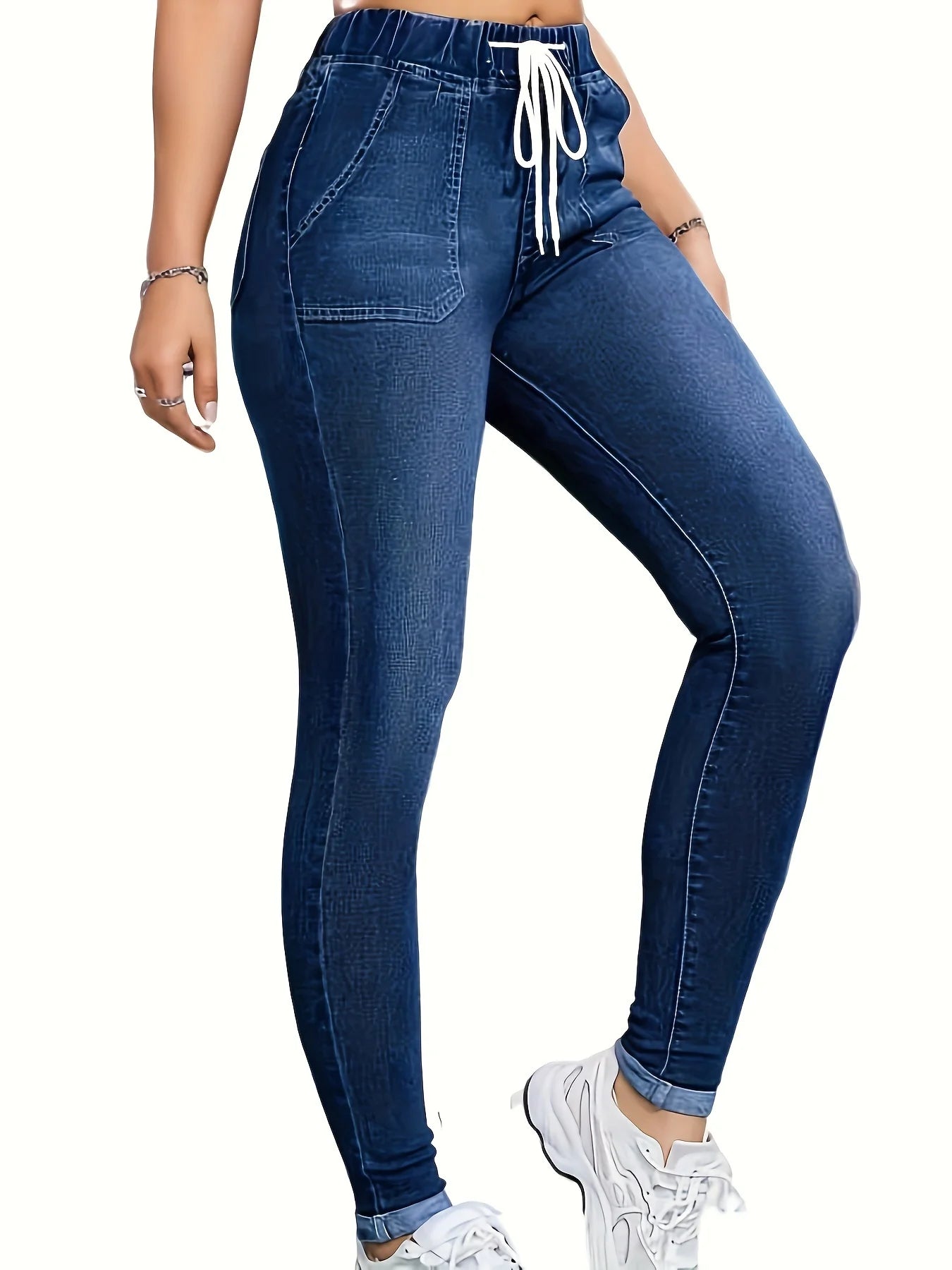 Women's high-waisted skinny jeans with drawstring waist, elastic cuffs, and slimming fit