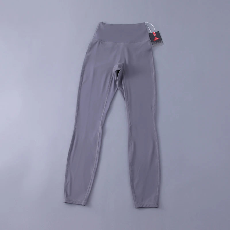 Women's high-waisted yoga pants with sculpting peach lift, buttery soft fabric for running and training.