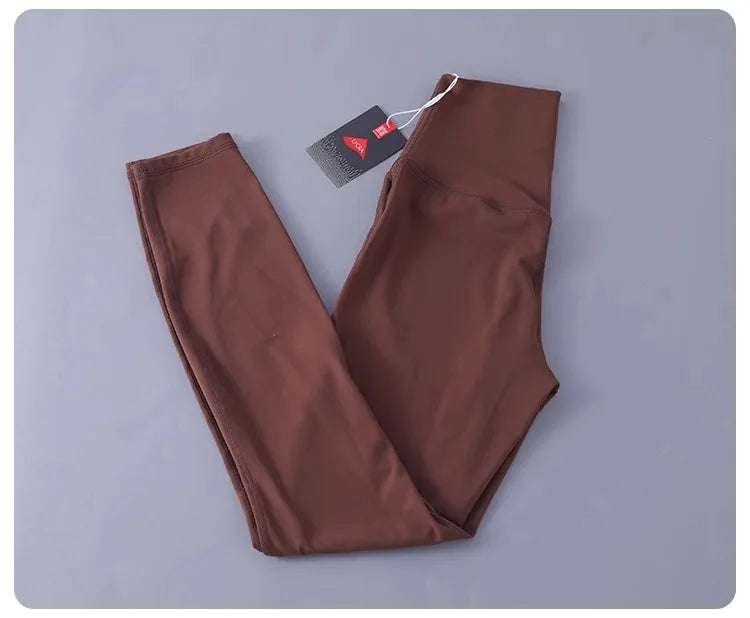 Women's high-waisted yoga pants with sculpting peach lift, buttery soft fabric for running and training.