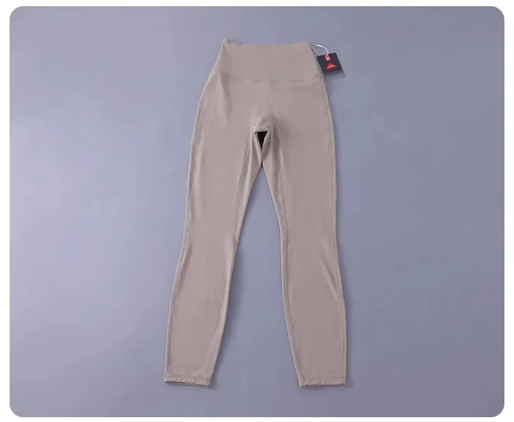 Women's high-waisted yoga pants with sculpting peach lift, buttery soft fabric for running and training.