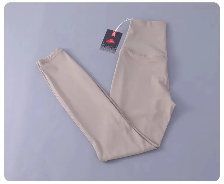 Women's high-waisted yoga pants with sculpting peach lift, buttery soft fabric for running and training.