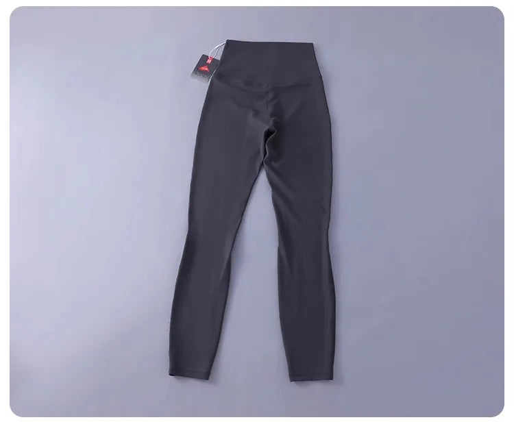 Women's high-waisted yoga pants with sculpting peach lift, buttery soft fabric for running and training.