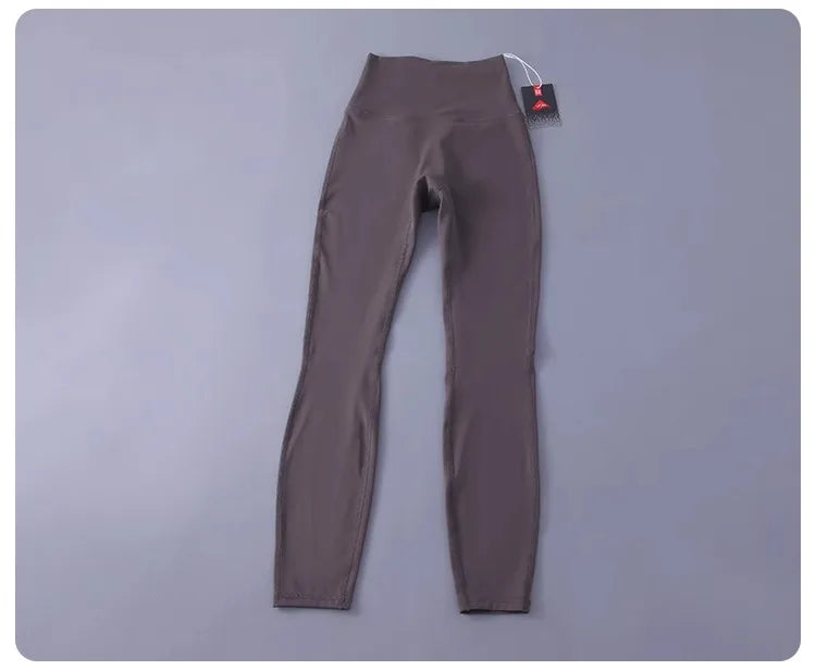 Women's high-waisted yoga pants with sculpting peach lift, buttery soft fabric for running and training.