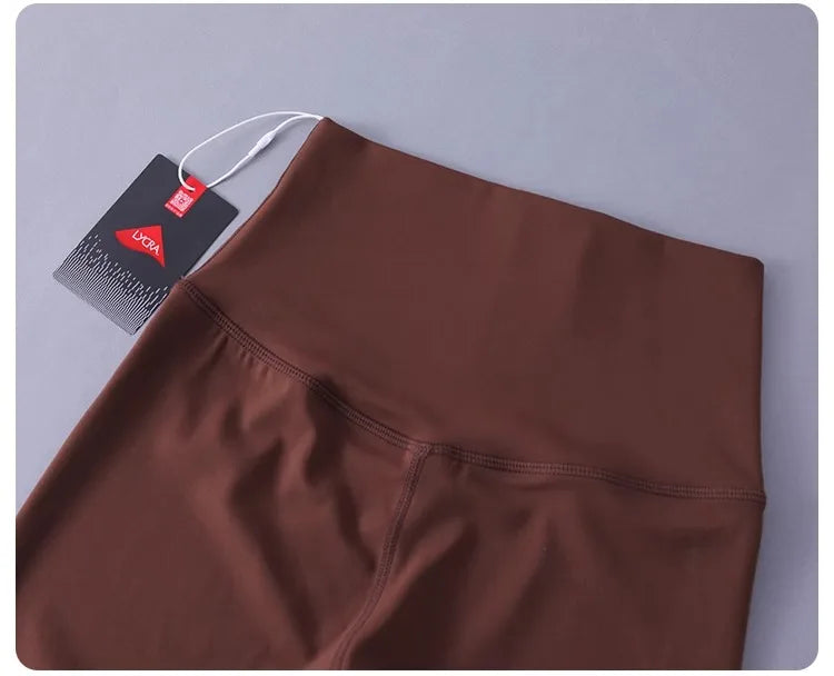 Women's high-waisted yoga pants with sculpting peach lift, buttery soft fabric for running and training.