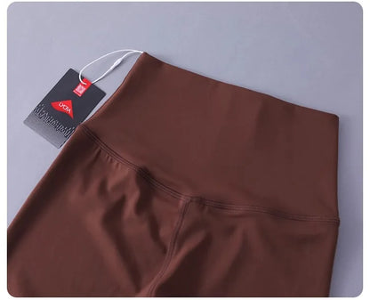 Women's high-waisted yoga pants with sculpting peach lift, buttery soft fabric for running and training.