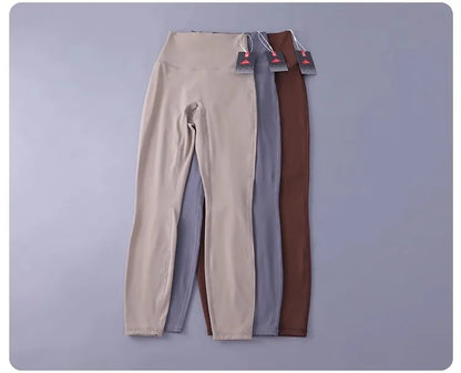 Women's high-waisted yoga pants with sculpting peach lift, buttery soft fabric for running and training.