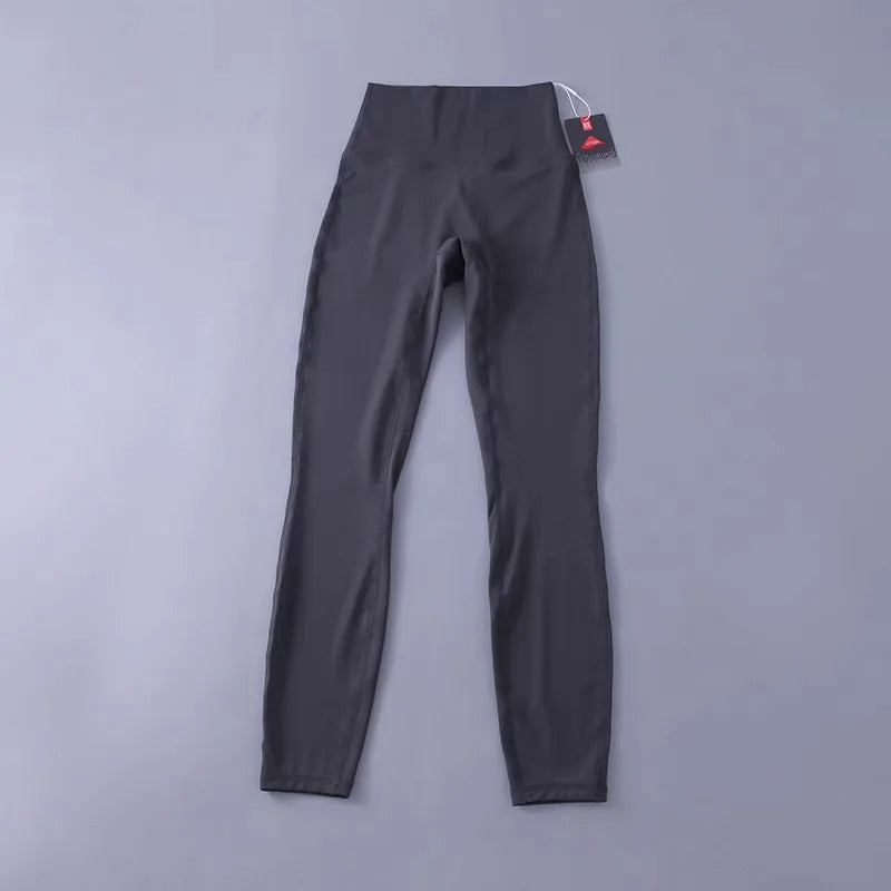 Women's high-waisted yoga pants with sculpting peach lift, buttery soft fabric for running and training.