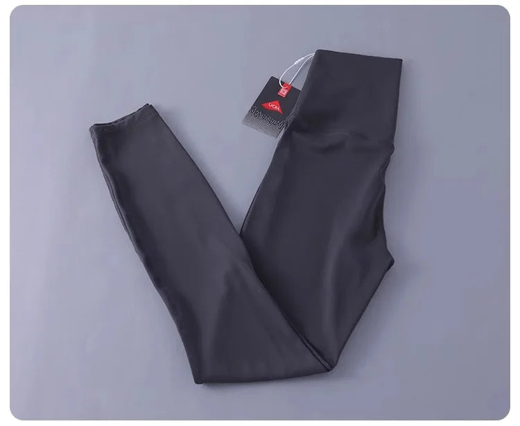 Women's high-waisted yoga pants with sculpting peach lift, buttery soft fabric for running and training.