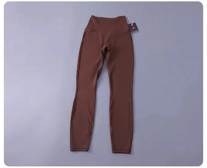 Women's high-waisted yoga pants with sculpting peach lift, buttery soft fabric for running and training.