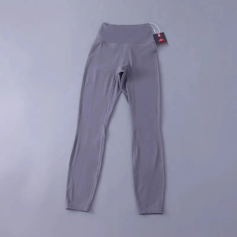 Women's high-waisted yoga pants with sculpting peach lift, buttery soft fabric for running and training.