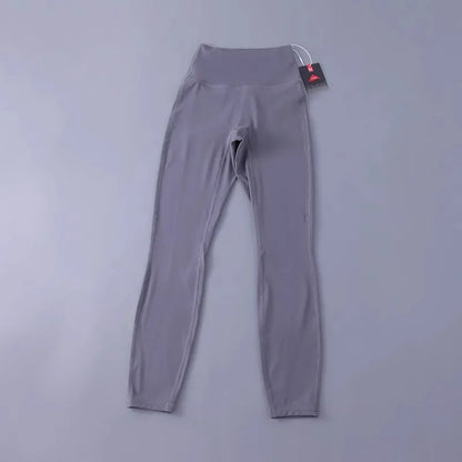 Women's high-waisted yoga pants with sculpting peach lift, buttery soft fabric for running and training.