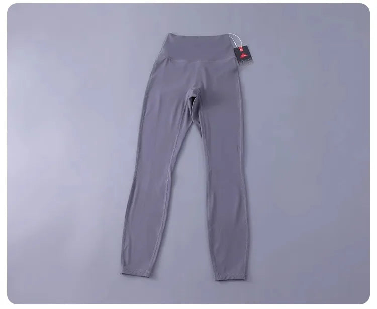 Women's high-waisted yoga pants with sculpting peach lift, buttery soft fabric for running and training.