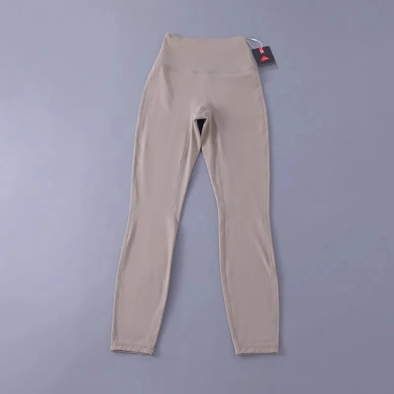 Women's high-waisted yoga pants with sculpting peach lift, buttery soft fabric for running and training.