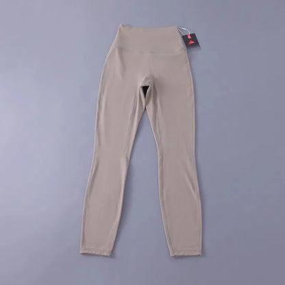 Women's high-waisted yoga pants with sculpting peach lift, buttery soft fabric for running and training.