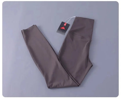 Women's high-waisted yoga pants with sculpting peach lift, buttery soft fabric for running and training.