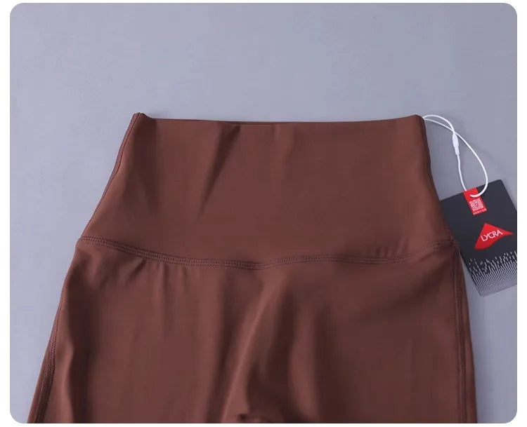 Women's high-waisted yoga pants with sculpting peach lift, buttery soft fabric for running and training.