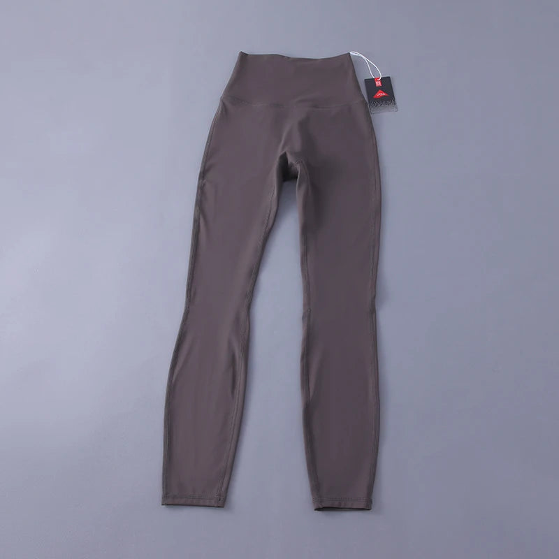 Women's high-waisted yoga pants with sculpting peach lift, buttery soft fabric for running and training.