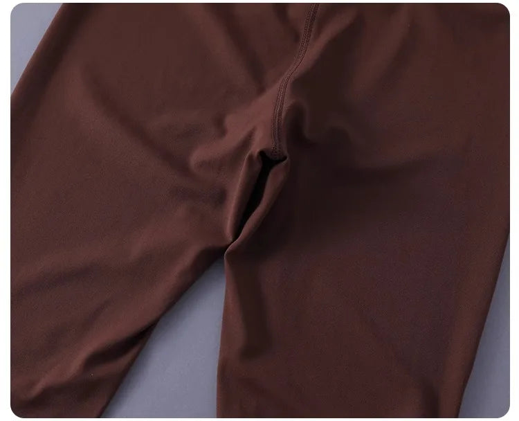 Women's high-waisted yoga pants with sculpting peach lift, buttery soft fabric for running and training.