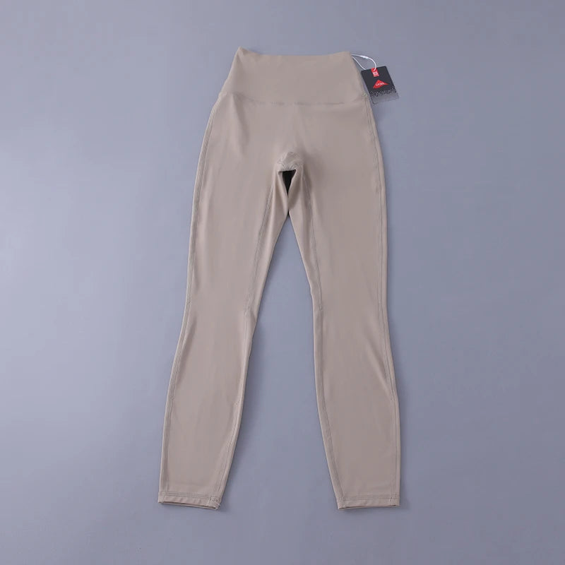 Women's high-waisted yoga pants with sculpting peach lift, buttery soft fabric for running and training.