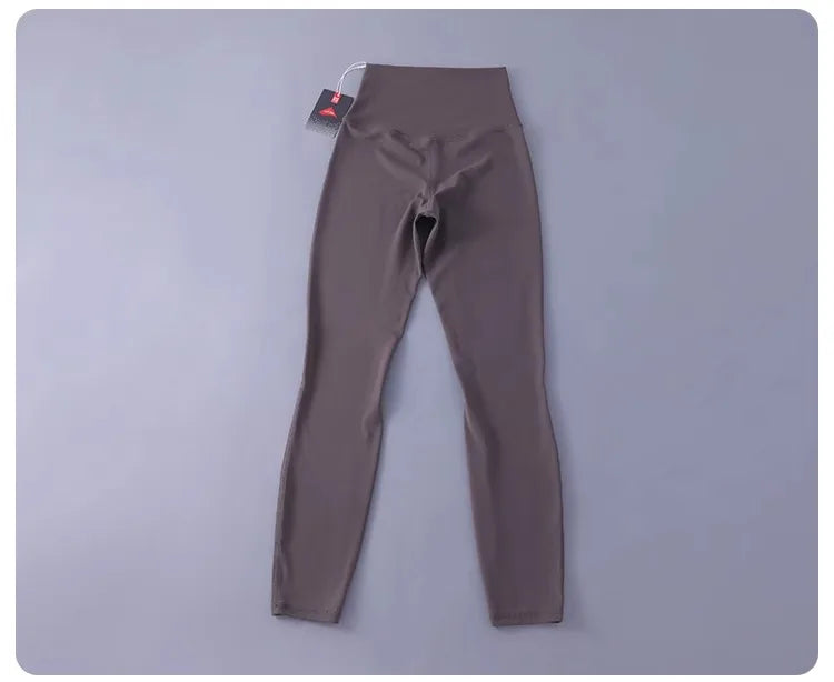 Women's high-waisted yoga pants with sculpting peach lift, buttery soft fabric for running and training.