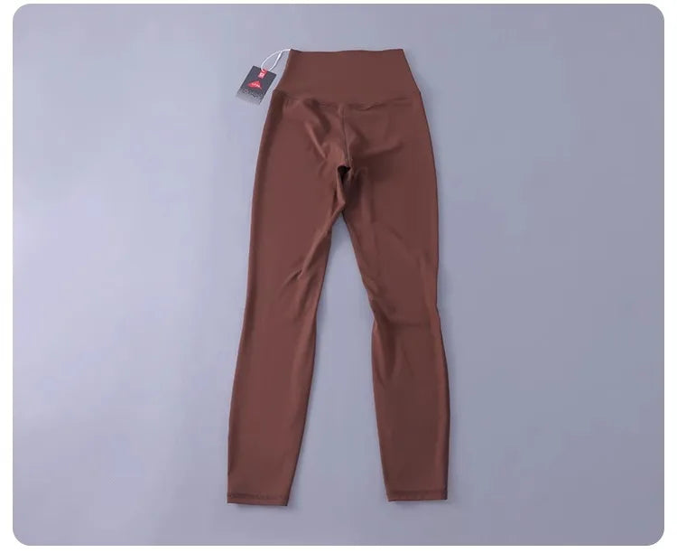 Women's high-waisted yoga pants with sculpting peach lift, buttery soft fabric for running and training.