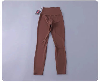 Women's high-waisted yoga pants with sculpting peach lift, buttery soft fabric for running and training.