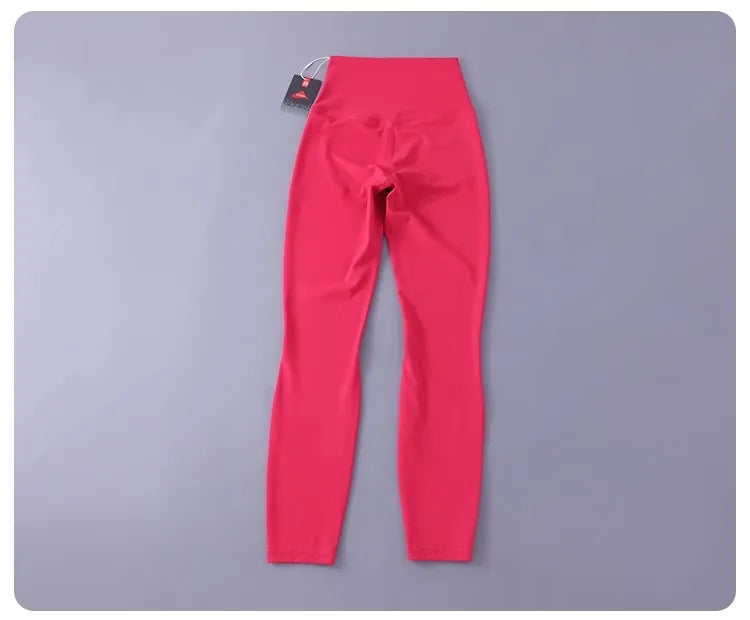 Women's high-waisted yoga pants with sculpting peach lift, buttery soft fabric for running and training.