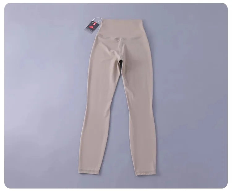 Women's high-waisted yoga pants with sculpting peach lift, buttery soft fabric for running and training.