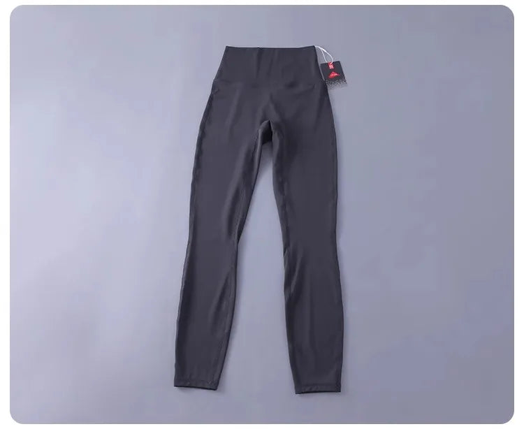 Women's high-waisted yoga pants with sculpting peach lift, buttery soft fabric for running and training.