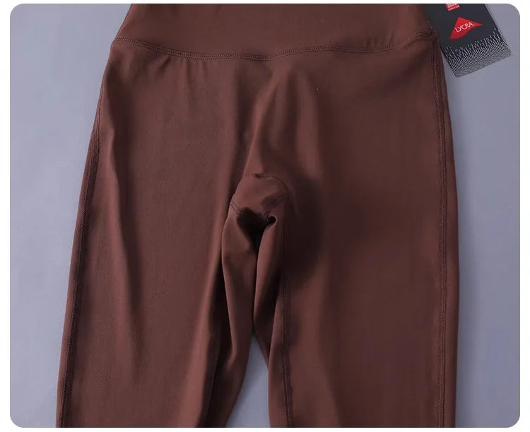 Women's high-waisted yoga pants with sculpting peach lift, buttery soft fabric for running and training.