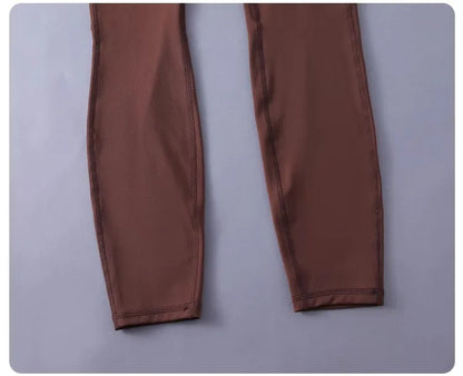 Women's high-waisted yoga pants with sculpting peach lift, buttery soft fabric for running and training.