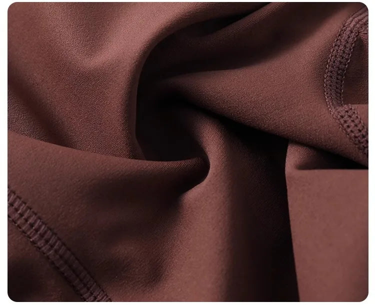 Women's high-waisted yoga pants with sculpting peach lift, buttery soft fabric for running and training.